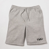 A heathered grey fleece sweat shorts feature "TMU" on the left hip, printed in black.