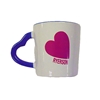 A white ceramic coffee mug with a red heart and the word Ryerson in red text appearing on the side in the shape of a heart along with a blue handle in the shape of a heart